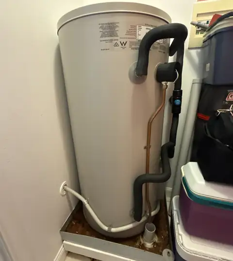 A hot water system installed against a wall, from the Woodward Google listing
